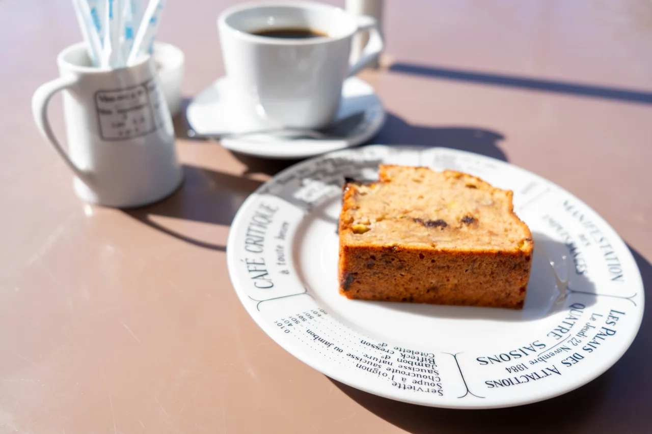 Banana bread served on a plate with coffee